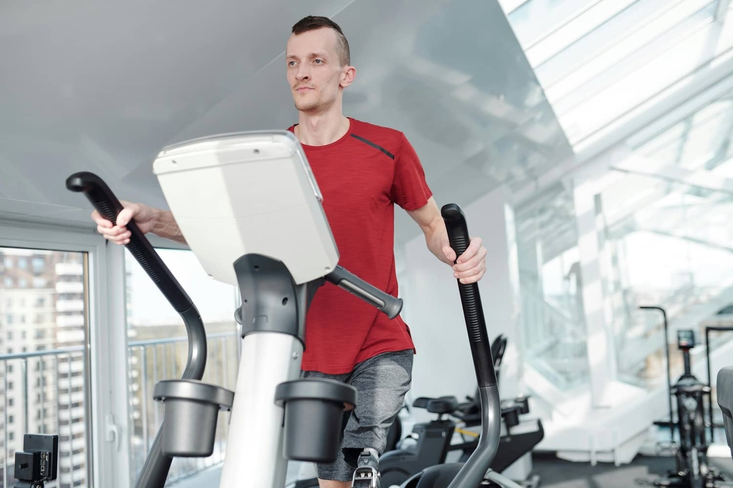 A man training on an elliptical machine