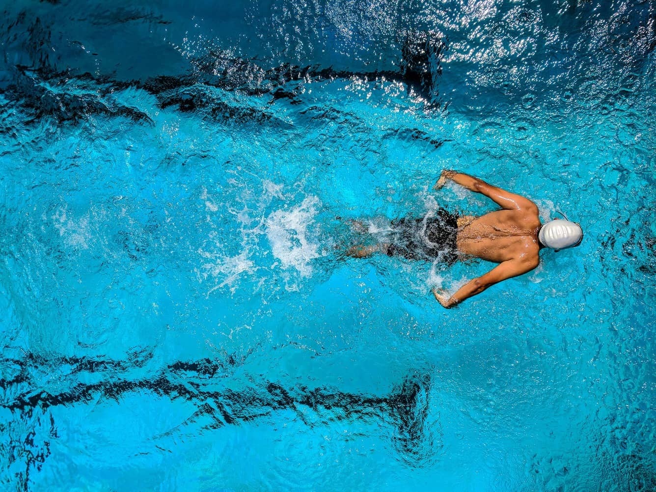 A person swimming in a pool