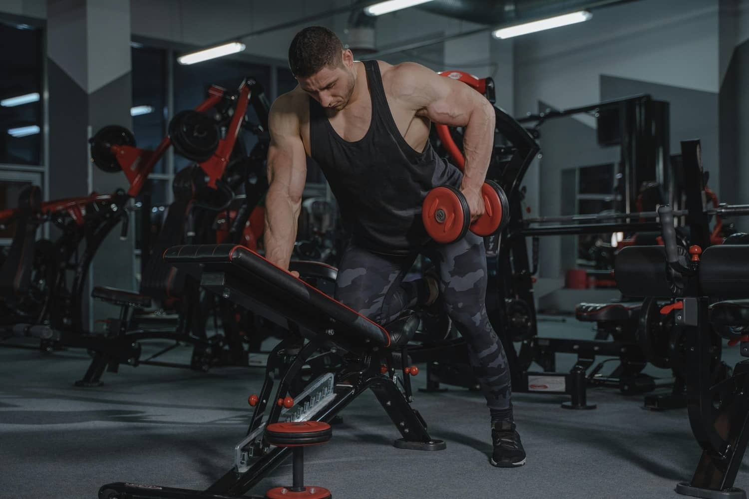 A bodybuilder doing single-arm dumbbell rows