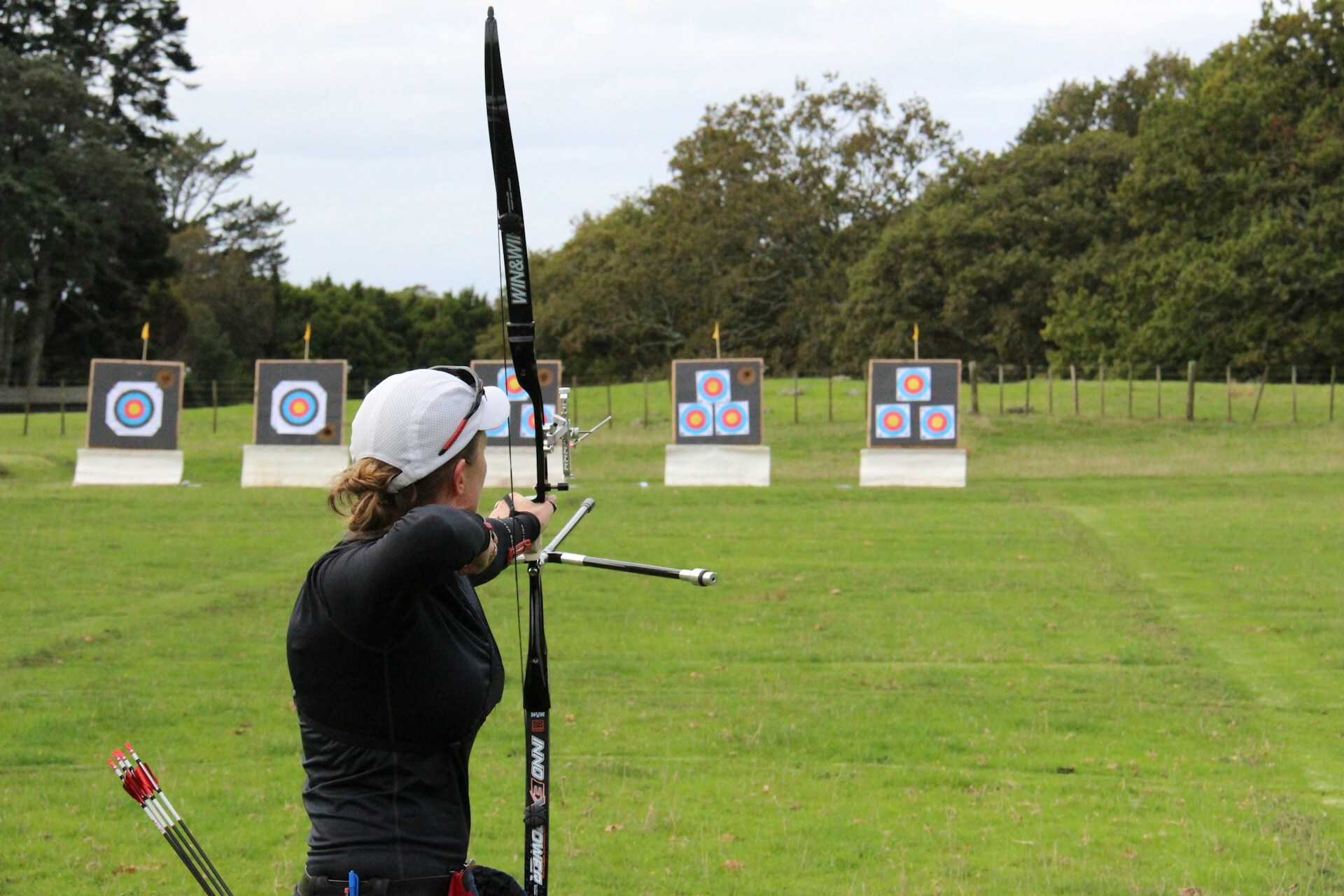 Woman shooting a recurve bow