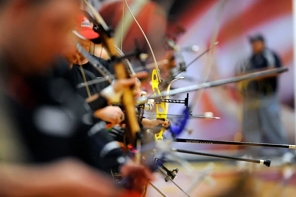 archers in line during competition - assembly process