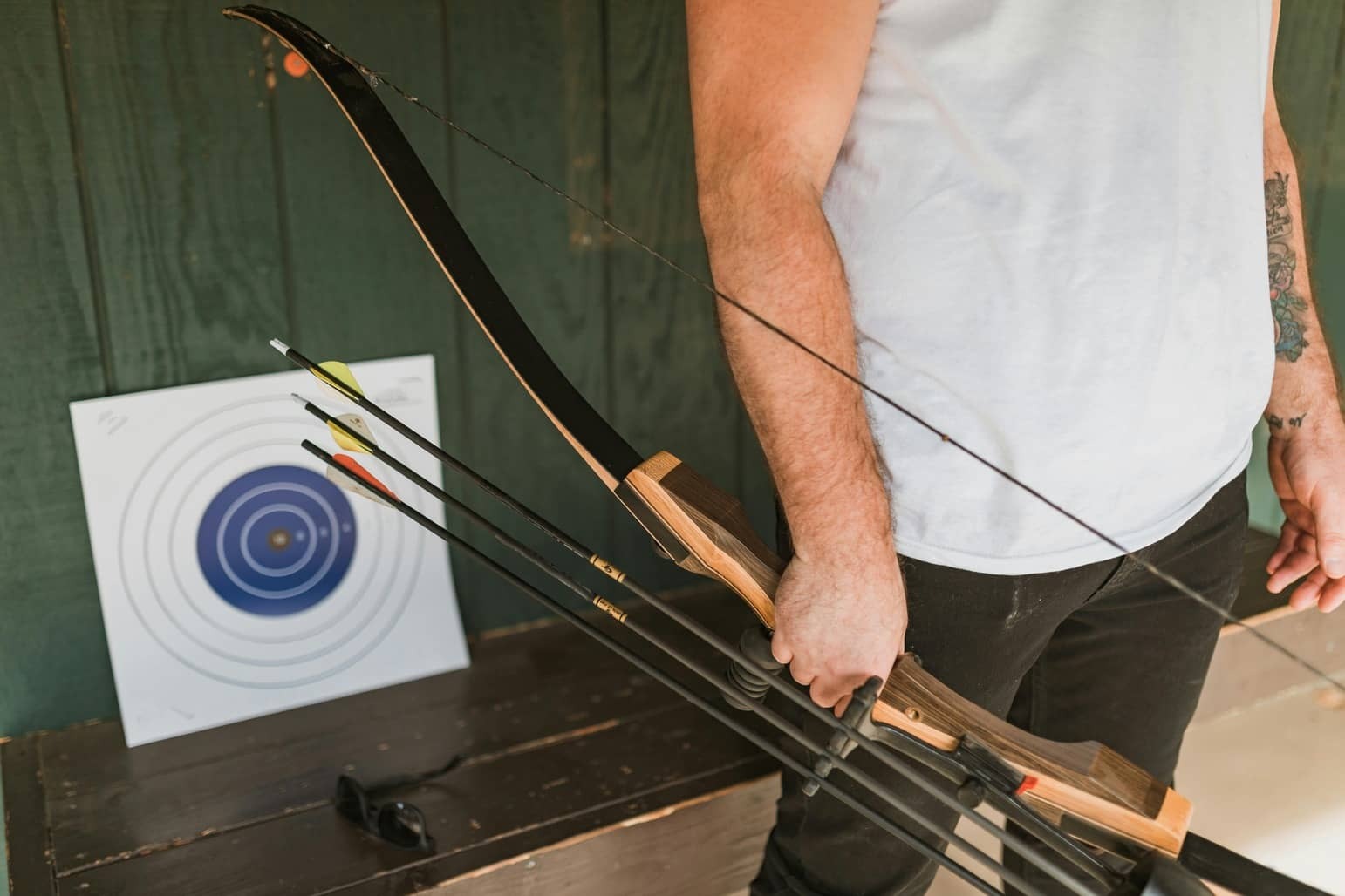 A man holding a recurve bow