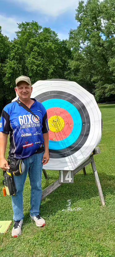 60X Staff Shooter, Wesley French, with a round bale target