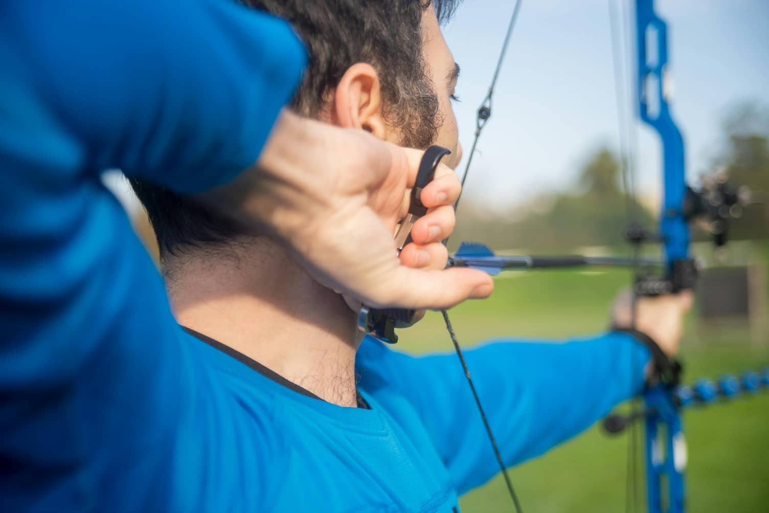An archer aiming a bow