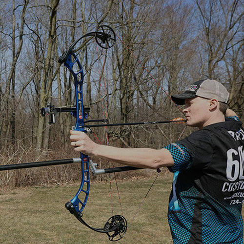 Brad Patsy, owner and founder, shooting a bow