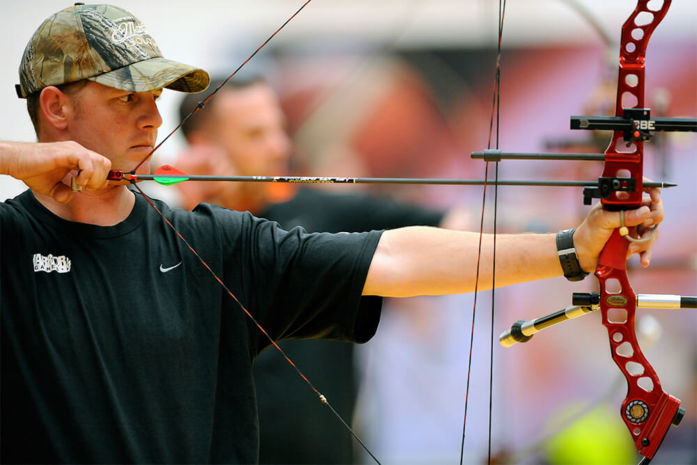 army vet shooting bow with archery sponsorship
