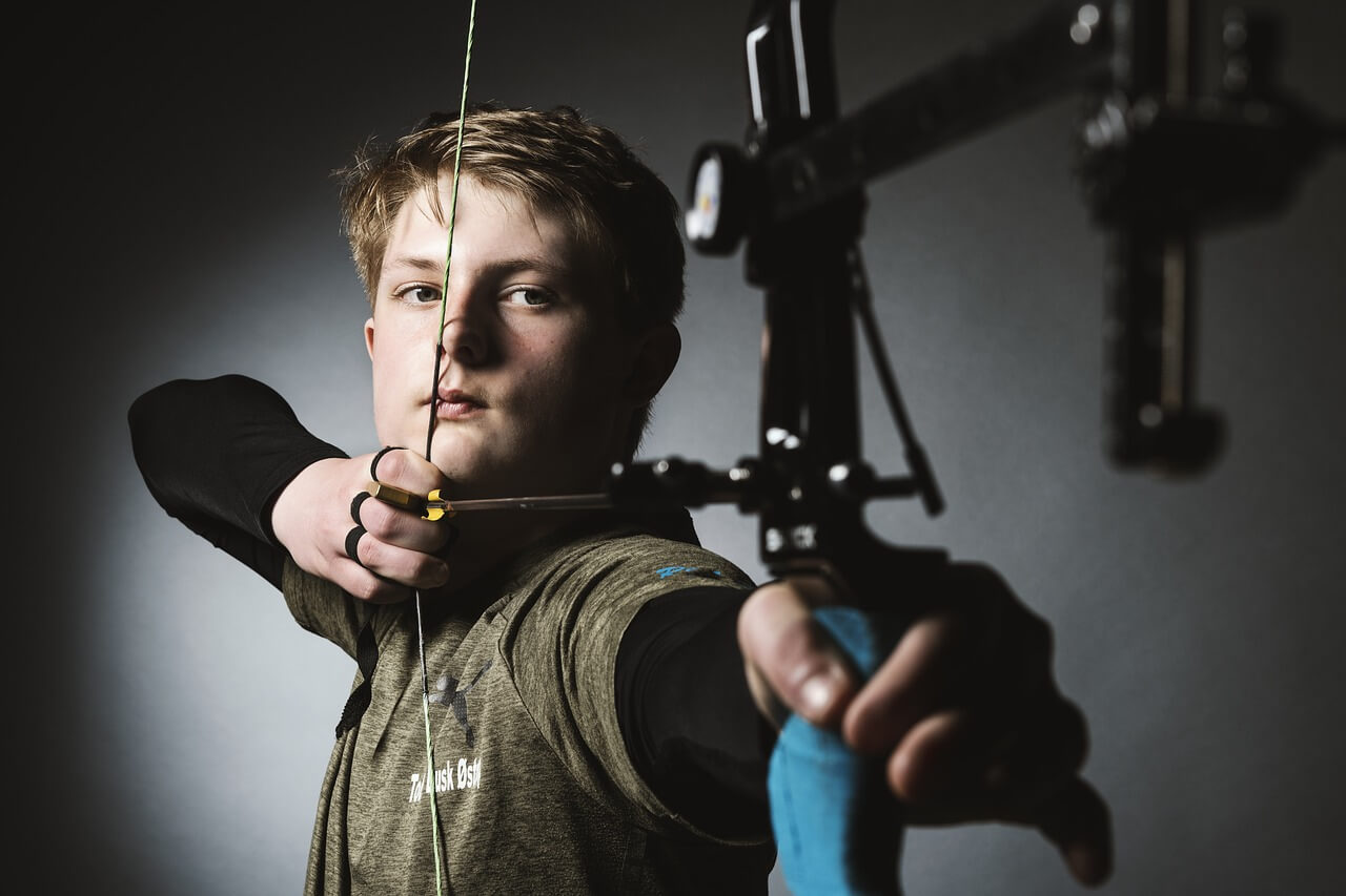 young boy shooting bow archery sponsorship