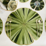Add a Shapely LilyPad Placemat Carole Shiber Designs, green lily pad-inspired decorative placemat with gold trim.