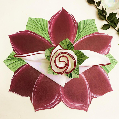 Poinsettia Placemat Carole Shiber Designs, festive holiday-themed placemat with red and green poinsettia flower design and decorative rose center.
