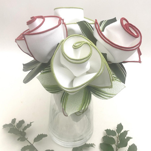 White Christmas Bouquet, Carole Shiber Designs, decorative ribbon-made flowers in a glass vase with green leaves.