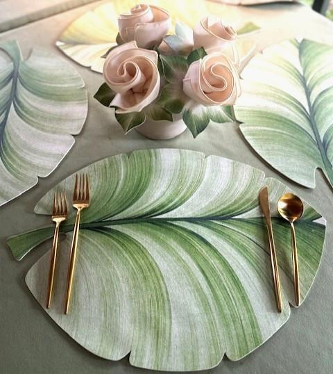 Palm Leaf Placemat by Carole Shiber, showcasing a realistic green palm leaf design on the placemat set on a dining table.