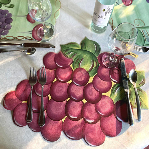 Burgundy Grapes Placemat by Carole Shiber Designs, artistic grapevine pattern on a table setting with glassware and cutlery.