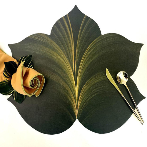 Add a 5 Point Fountain Leaf - Pine/Gold Placemat Carole Shiber Designs, black and gold leaf-shaped placemat with decorative fabric flowers and gold utensils.