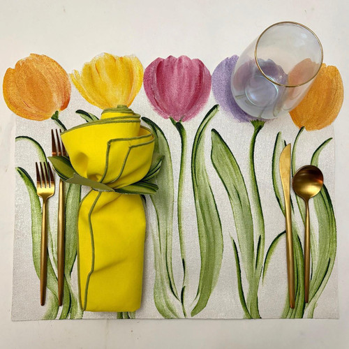 Add a Tulips Standing Tall Placemat Carole Shiber Designs, colorful breakfast setting with tulip-themed placemat and tableware.