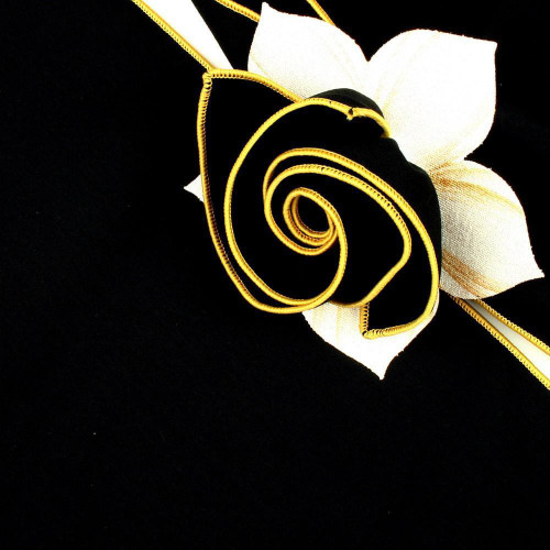 Add a Black with Gold Trim Napkin Carole Shiber Designs, decorative black napkin with gold trim and a white flower embellishment.