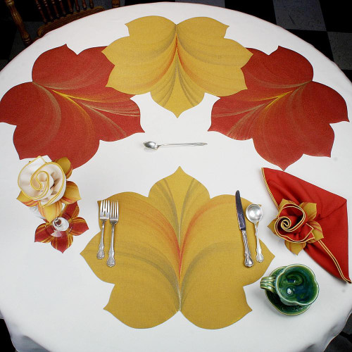 7 Point Leaf - Gold/Copper & Bronze Carole Shiber Designs, decorative leaf-shaped table placemats in gold, copper, and bronze colors on a white table.