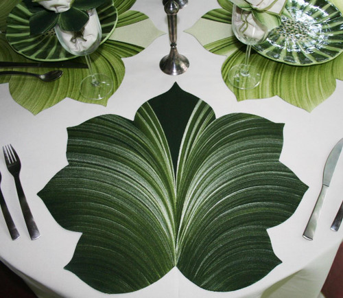 7 Point Leaf - Pine/Frost Carole Shiber Designs, decorative table setting with large green leaf-shaped placemats and glassware.