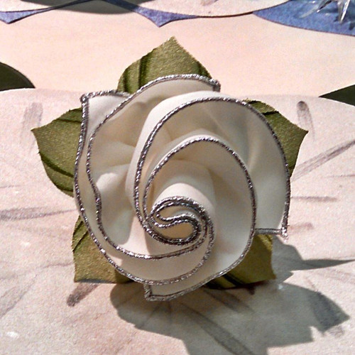 Add a White with Sparkly Silver Trim Napkin Carole Shiber Designs, decorative napkin with white fabric edged with silver glitter trim, designed by Carole Shiber.