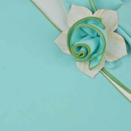 Add a Round Aqua with HoneyDew Trim Napkin by Carole Shiber Designs, featuring a circular aqua-colored napkin with honeydew-green trim and decorative floral accents.