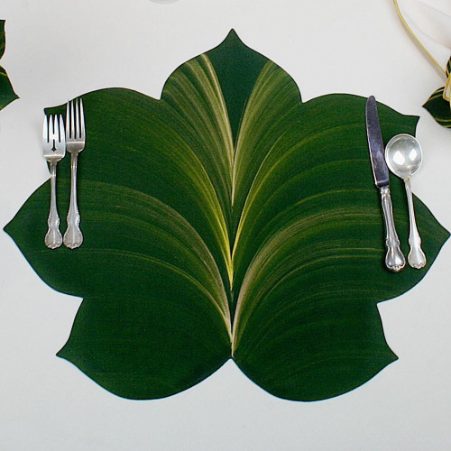 7 Point Leaf - Pine/Gold & Bronze Carole Shiber Designs, a decorative leaf-shaped placemat with green and gold intricate leaf pattern, placed under silverware for an elegant table setting.