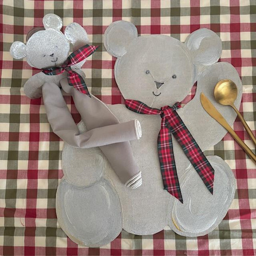 Teddy Bear Place-Setting with Plaid Ribbons, a plush teddy bear with a plaid ribbon around its neck, placed on a decorative teddy bear-shaped placemat on a checkered tablecloth with gold-colored spoon and knife, suitable for a children's dining setup. Teddy Bear Place-Setting with Plaid Ribbons, a plush teddy bear with a plaid ribbon around its neck, placed on a decorative teddy bear-shaped placemat on a checkered tablecloth with gold-colored spoon and knife, suitable for a children's dining setup.