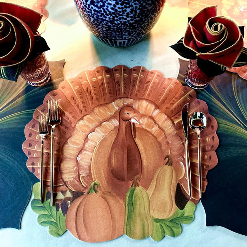 Classic Maples SALE! Set of 8, festive fall-themed paper placemats with pumpkin and squash designs, on a table setting with cutlery and decorative flowers.