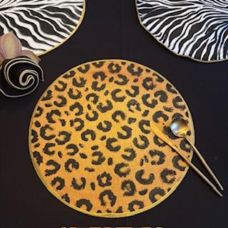 Leopard Round Carole Shiber Designs, a round plate with a yellow and black leopard print pattern.