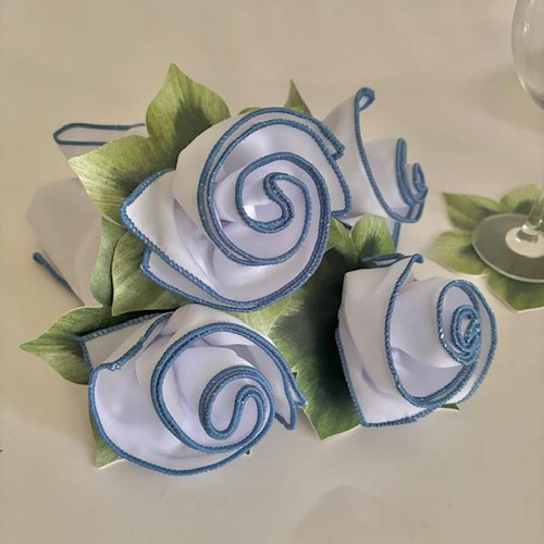 Classic Hydrangea Napkin Bouquet for 4, elegant white and blue fabric napkins folded to resemble flowers with green leaves, perfect for table setting decor.