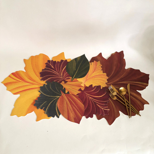 Carole Shiber has gathered these 3 placemats to make this beautiful runner: Multi-Colored Swirling Leaves Placemat, sandwiched between 2 Maple Leaf Placemats in Gold/Copper and Copper/Gold. Set them your way!