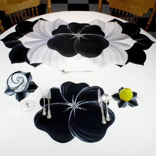Buttercup Placemat - Black/Silver Carole Shiber Designs, black and silver floral placemat on white table with matching napkin and tableware.