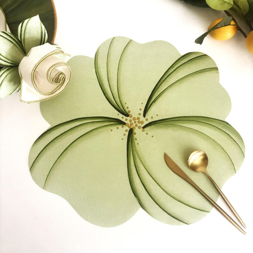 Buttercup Placemat - Mint by Carole Shiber Designs, flower-shaped mint green placemat with layered petal detailing and gold center, styled with gold cutlery and a rolled napkin.