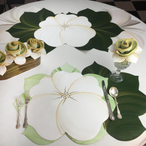 Buttercup Placemat - White/Gold, a beautiful white and gold floral designed placemat by Carole Shiber Designs, decorated with green leaves and cream-colored roses.