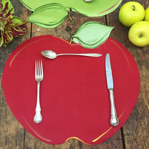 Carole's Red Apple, limited edition decorative placemat with silverware set on and apple-themed design.