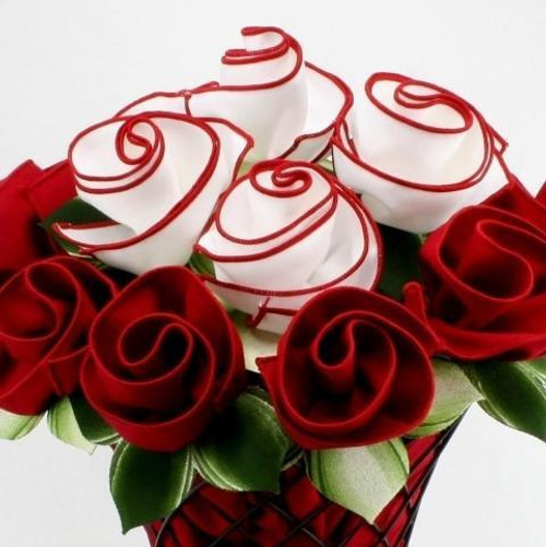 Red & White Bouquet Carole Shiber Designs, a bouquet of white roses with red swirl accents surrounded by deep red roses and green leaves.