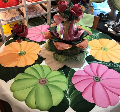 Pastel Poppies, Set of 4 Carole Shiber Designs table decor with colorful poppy flower designs in pink, orange, and green on a table display.