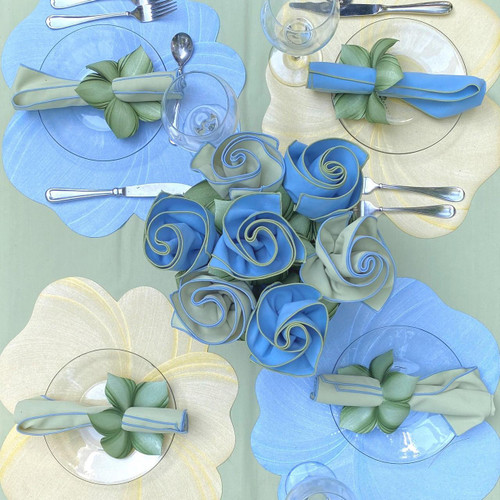 Summer Soft Blue, Green & Yellow Carole Shiber Designs, table setting with fabric flower napkin rings, glassware, and decorative placemats.