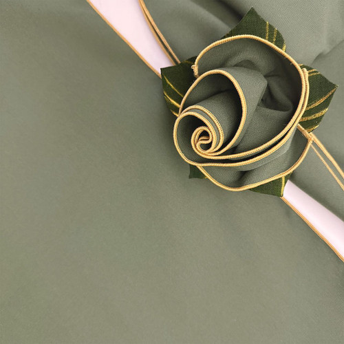 Pine with Gold Trim Napkin Carole Shiber Designs, a green fabric napkin with gold trim designed in the shape of a rose.