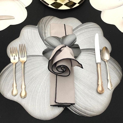 Buttercup Setting: Grey/Black Carole Shiber Designs, elegant table setting with gold cutlery, a floral napkin, and a unique flower-shaped placemat.