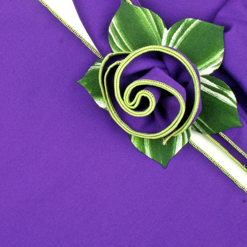 Product Purple with Honeydew Trim Napkin Carole Shiber Designs, close-up of a purple napkin decorated with a green honeydew trim and fabric flower. Product Purple with Honeydew Trim Napkin Carole Shiber Designs, close-up of a purple napkin decorated with a green honeydew trim and fabric flower.