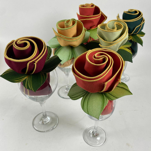 Thanksgiving Bouquet Carole Shiber Designs, colorful fabric roses arranged in wine glasses with green leaves.