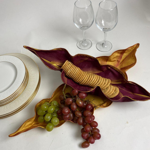 Cheese & Cracker Basket Duet Carole Shiber Designs, decorative leaf-shaped serving bowl with crackers, grapes, and empty wine glasses. Cheese & Cracker Basket Duet Carole Shiber Designs, decorative leaf-shaped serving bowl with crackers, grapes, and empty wine glasses.