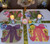 Party Assortment, Set of 4 Carole Shiber Designs table setting with colorful bows and roses, candles, and tableware for celebration.
