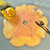 Party Pansy Centerpiece/3 Settings ~ Trio, decorative floral table setting with a large pansy-shaped placemat, a yellow rose-shaped napkin, a wine glass, and gold-colored cutlery. Party Pansy Centerpiece/3 Settings ~ Trio, decorative floral table setting with a large pansy-shaped placemat, a yellow rose-shaped napkin, a wine glass, and gold-colored cutlery.