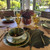 Classic Maple Leaf Collection, S/4 Assorted dinnerware and glassware set on dining table with floral centerpiece
