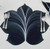 7 Point Leaf - Black/White Carole Shiber Designs, decorative black and white leaf-shaped placemat on a table setting with silverware.