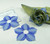 Add a Bouquet Napkin Ring - Light Blue Carole Shiber Designs, fabric napkin rings with blue petal design and light blue trim for elegant table settings.