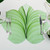 7 Point Leaf - Mint/Pine Carole Shiber Designs, decorative leaf-shaped place setting with silverware on a white surface.