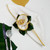 7 Point Leaf - Pine/Gold & Bronze Carole Shiber Designs, elegant napkin with a pine leaf-shaped napkin ring in gold and bronze tones, on white tablecloth with silverware and green leaf decor.