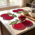 Cherries Placemat, decorative cherry-themed placemats on a kitchen countertop with cherries in a glass bowl and bowls for serving.