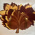 Jeweltone Maple Leaf Placemats, sale, decorative maple leaf-shaped placemats in autumn colors with gold dessert forks and spoon on a white background.